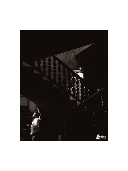 An artistic shot using shadows and light on a staircase. I enjoy creating these moody, dramatic portraits that add a different dimension to a pre-wedding album.