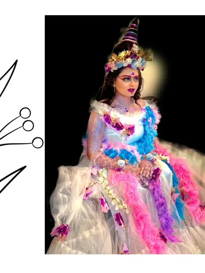 A creative and artistic look featuring our white ruffle gown. The unique headpiece and makeup show how you can style our outfits to create a one-of-a-kind look.