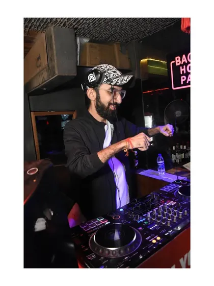A candid moment of me in the booth. Every night is a new opportunity to work hard and play hard.