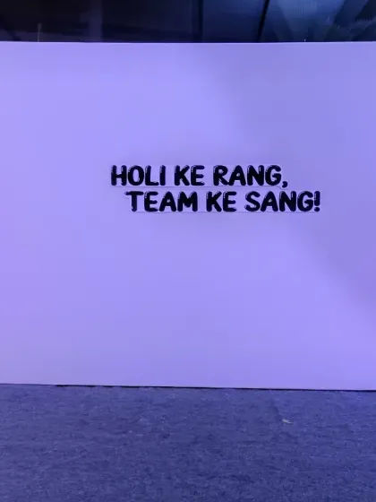 Holi ke rang, Team ke sang! We love adding fun taglines to our backdrops. This simple but effective wall was part of a larger Holi decoration, creating a great spot for team photos.