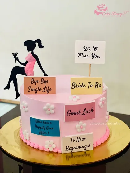 A 'Bye Bye Single Life' cake for a bride-to-be. This pink cake is decorated with messages from her friends, making it a sweet and personal gift for her bachelorette party.