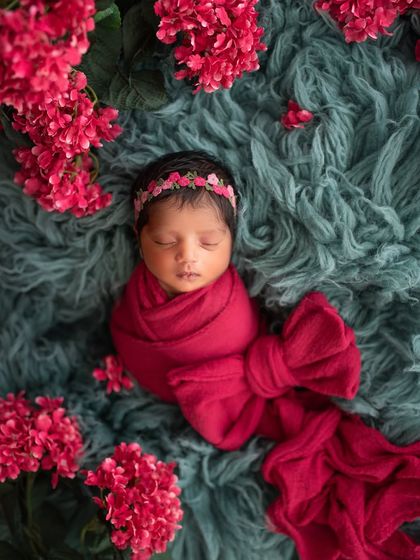 A bold and beautiful setup using a rich red wrap and flowers against a textured teal background. I love this unique and striking color combination.