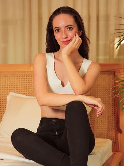 A sweet and engaging portrait with the model smiling at the camera, showing a different, more commercial look.