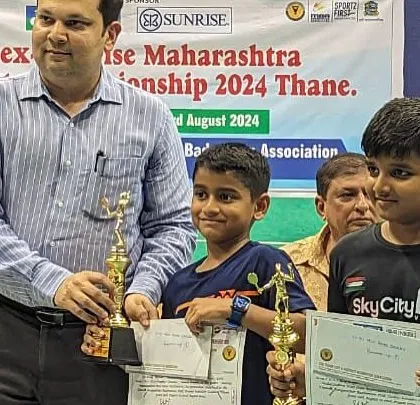 Ajinkya Desai receiving his trophy for the Under 11 Boys Doubles at the Yonex Sunrise Maharashtra Mini State Championship in Thane.