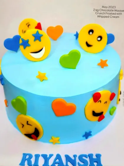A fun and expressive emoji-themed cake. This 2kg Chocolate Mousse Crunch cake is covered in colourful, happy, and silly fondant emojis.