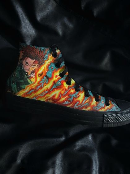 A side profile of the Tanjiro custom Converse, highlighting the Hinokami Kagura (Dance of the Fire God) design.