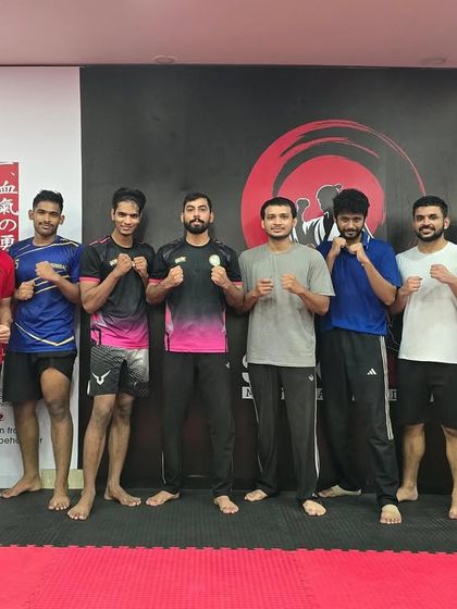 Our morning batch stands ready with their coach. Starting the day with training sets a powerful tone for everything else.