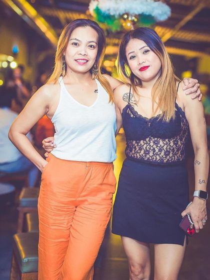 Two friends posing for a photo.