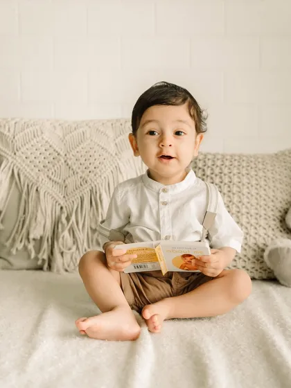 A look of sweet surprise. These simple studio sessions are perfect for capturing baby's first year.