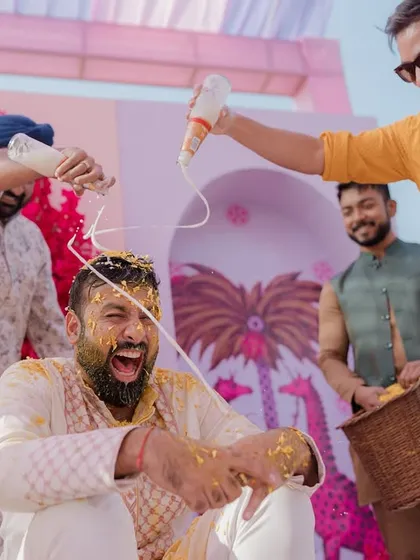 Another angle of the groom's wild Haldi, showing the sheer joy and energy of the moment.