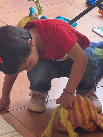 A curious little one exploring my puppets after a show. My puppets are all very friendly and love meeting the children.