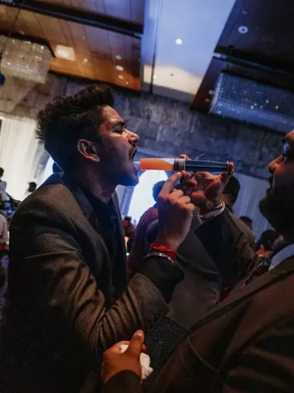 Getting the party started with a direct syringe shot. Our bartender ensures every guest gets a taste of the fun, making the rounds on the dance floor.