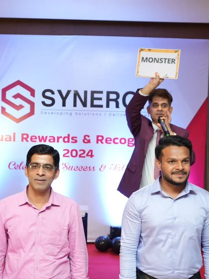Playing a game of 'guess the word' at the Synergix annual rewards night. This game, sometimes called dumb charades, is a classic way to get teams laughing.