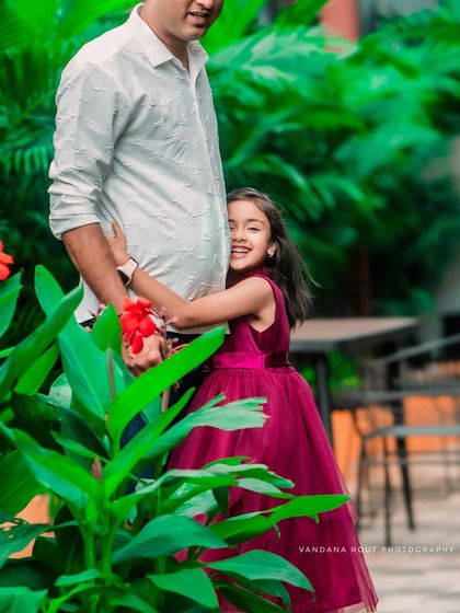 This sweet moment captures a daughter giving her father a big hug. It's a candid shot that perfectly illustrates the loving "Papa ki pari" bond.