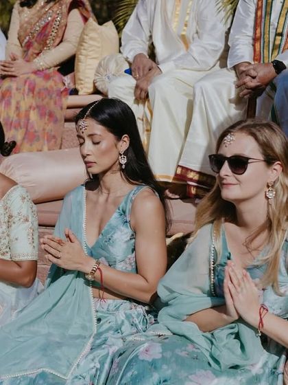Guests participating in the serene and beautiful morning puja ceremony at Khimsar Fort.