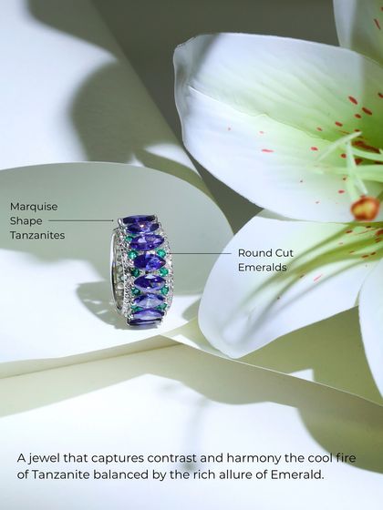 A product shot of the Tanzanite and Emerald ring, capturing the cool fire of the tanzanite balanced by the rich allure of the emerald.