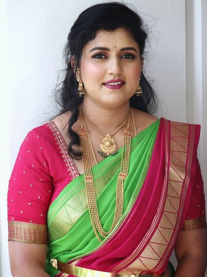 Mrs. Shreegowri looking elegant for an engagement ceremony she was attending. This is a great example of a sophisticated party makeup look, with soft makeup and simple gold jewellery.