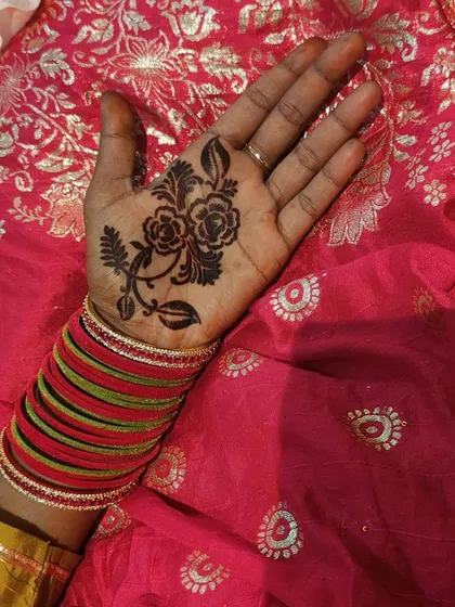 See how easy it is to get a beautiful design with my mehndi stencils. This shows a floral vine stencil applied to the palm. You just stick the stencil, apply the henna paste over it, let it dry, and peel it off for a perfect outline.