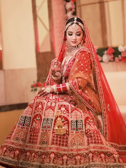 A serene and elegant portrait. The bride's makeup is soft and glowing, perfectly complementing her delicate features.