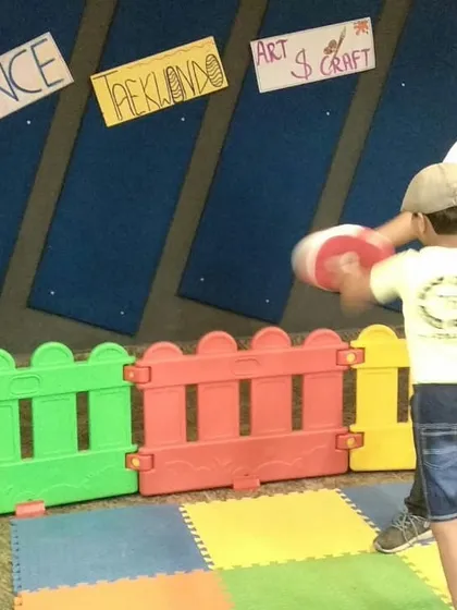Another young student practices his punches at our summer camp. We create a playful environment where kids can learn valuable self-defence skills.