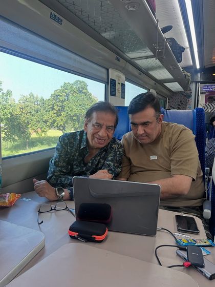 The learning doesn't stop in the jungle. Even while traveling, we use the time to review images and discuss post-processing techniques. Here I am with a participant on the train back from our Panna workshop.