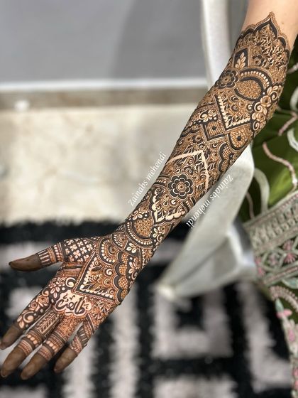 Another angle of Madeeha's full arm bridal henna, highlighting the detailed patterns and clean lines.