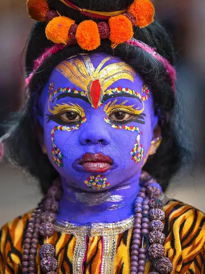 This powerful portrait of a child in traditional makeup for a cultural festival highlights the ability of our photographers to capture vibrant, expressive, and meaningful human moments.