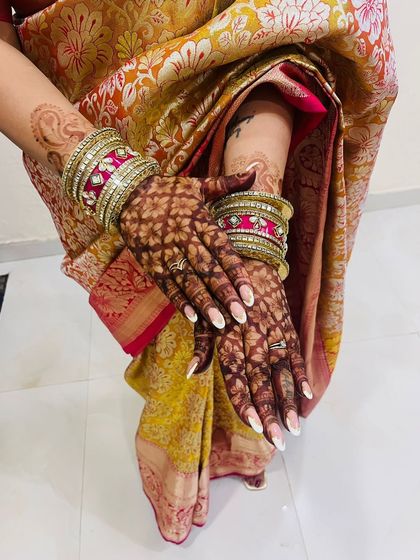 The beautiful dark stain of a full jaal (net) pattern for Karwa Chauth.