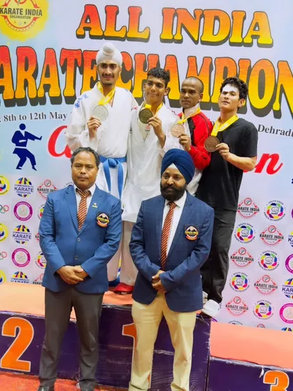 Standing on the podium after winning Silver at the All India Karate Championship. Every competition, win or lose, is a learning experience that makes me a better athlete and coach.