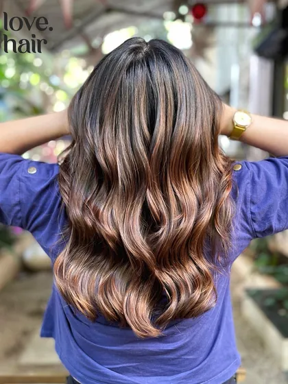 Another shot of the same mocha balayage, highlighting its beautiful rose-gold undertones in the light.