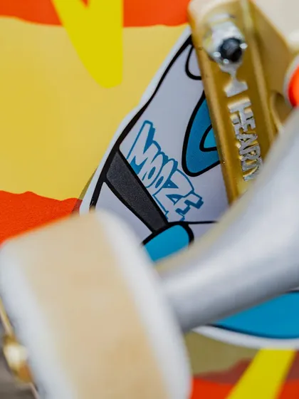 A detailed close-up of the Hearty deck, showing my 'Mooz' tag integrated into the artwork right on the skateboard truck.