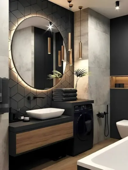 This modern bathroom design showcases a blend of luxury and functionality. It features dark hexagonal and concrete-style tiles, a backlit circular mirror, and a wood-finish vanity, creating a sophisticated and spa-like atmosphere.