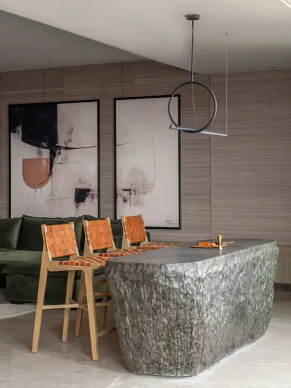 We love a little drama, and this bar counter, crafted from a single, hollowed-out block of stone, delivers just that. It’s a statement piece that anchors the home theatre area, showcasing our passion for using natural materials in bold, unexpected ways. This is custom craftsmanship at its most raw and refined.