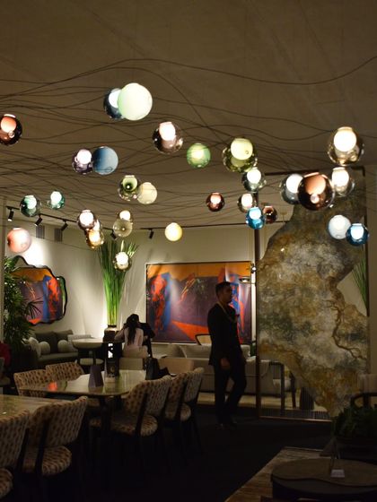 The full VIP lounge at the India Art Fair, where the Bocci 28 series creates a celestial canopy over the entire space, defining the atmosphere and creating a memorable experience for visitors.