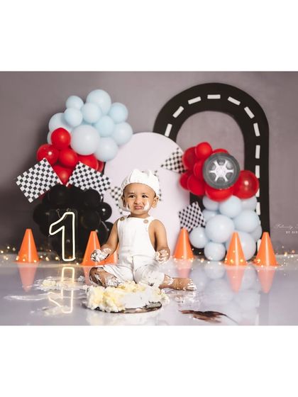 The aftermath of a fun race car cake smash! This little guy is covered in cake and happiness.