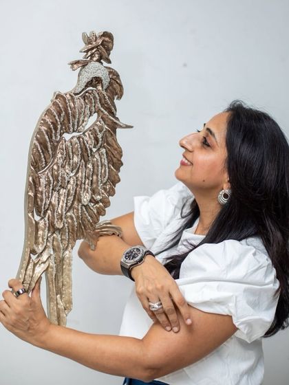 Holding "The Bronze Guardian." This piece is a tribute to the strength that safeguards heritage, people, and the future.