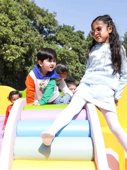 A great action shot of kids climbing and playing on the soft rainbow log climber.