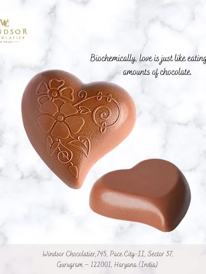 A beautifully molded milk chocolate heart with an intricate floral pattern. I use detailed molds to create chocolates that are as beautiful to look at as they are to eat.