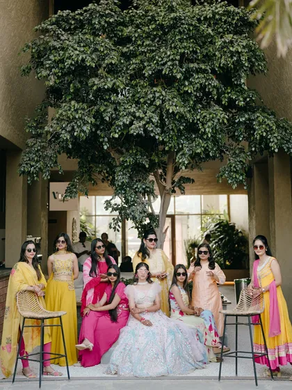 The bride with her squad. This cool and stylish group photo captures the fun and friendship of the bride and her bridesmaids during the pre-wedding festivities.