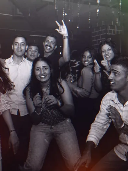 It's all about having fun with the crowd. A great shot of me and some partygoers dancing together, sharing a laugh.