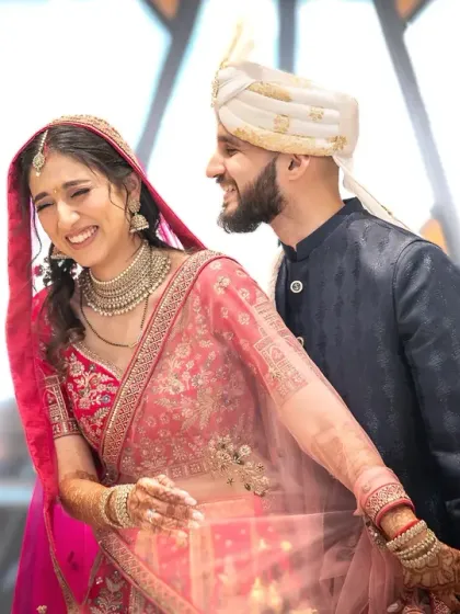 That split second of a shared joke. Capturing genuine laughter is my goal, and this candid moment from an Indian wedding is full of joy.