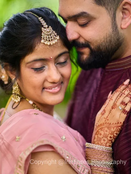 A tender moment captured outdoors, with the couple in a gentle embrace. Natural light and soft focus create a romantic and timeless feel for this engagement portrait.