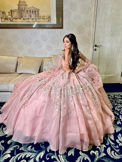 This is what I call a full princess doll look. For her engagement, we chose a dreamy, romantic style with glowing skin and soft pink tones to match her magnificent floral gown.