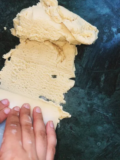 The process of making a tart starts with good dough. Here, I am working with the pate sablee, ensuring it has the perfect texture before rolling.