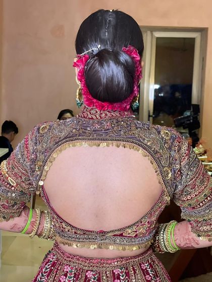 Another view of the simple and elegant sleek bun, a testament to the fact that sometimes the most classic styles are the most beautiful.