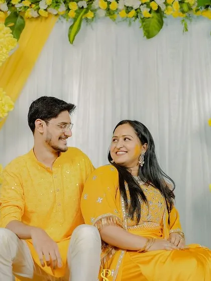 A sweet, candid portrait of the couple during their Haldi ceremony. The soft smiles and gentle gaze showcase the love and happiness of the day.