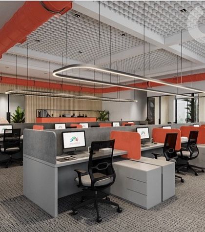 This open-plan office for All Services Global was designed to encourage collaboration. The workstations are arranged for easy communication, with pops of coral on the partitions and exposed ducting to add an industrial-chic vibe.