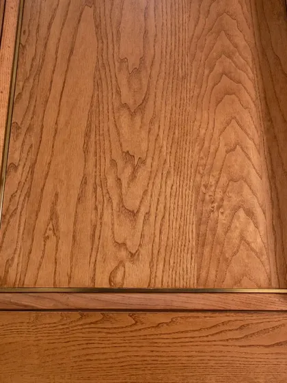 This crown-cut ashwood veneer door features a subtle metal inlay. The two-panel design is a classic choice that I've updated to feel fresh and modern.