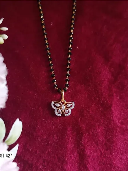 This delicate mangalsutra features a butterfly-shaped pendant made of American diamonds. It's a cute and modern design for everyday elegance.