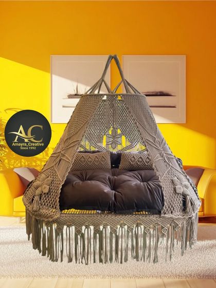 This is our Caramel Boomerang sofa bed swing. The deep, comfortable mattress invites you to just sink in and relax. It's the ultimate comfort piece for your living room.